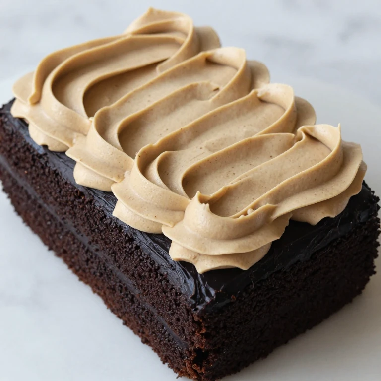 Midnight espresso sheet cake with tan espresso buttercream frosting swirls