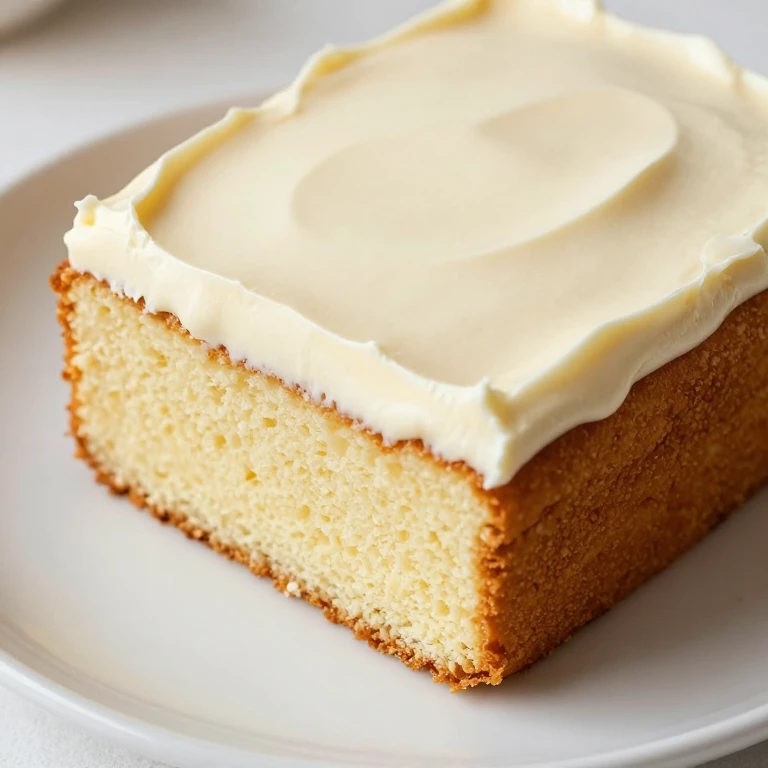 Golden vanilla sour cream sheet cake with buttercream frosting