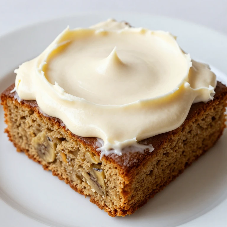 Brown butter banana sheet cake with cream cheese frosting, golden and fluffy