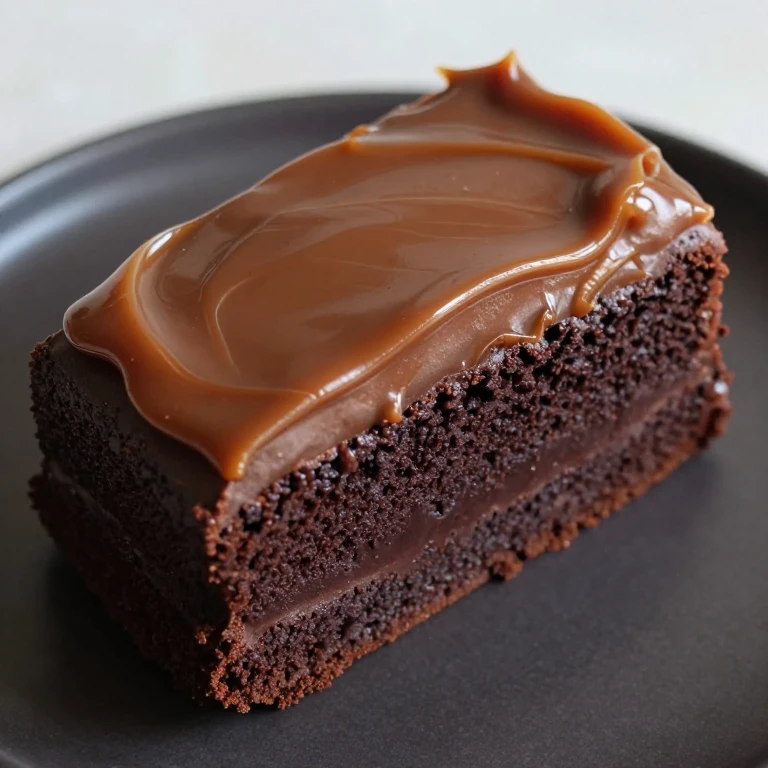 Stout chocolate sheet cake with whiskey caramel frosting, dark glossy finish