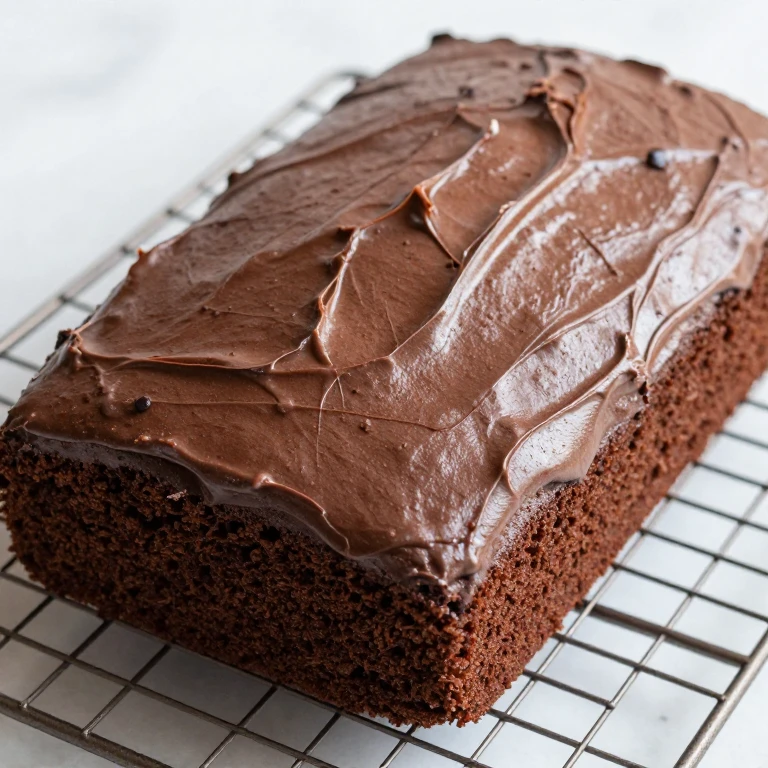 Cooled chocolate cake with smooth surface, ready for watercolor decoration