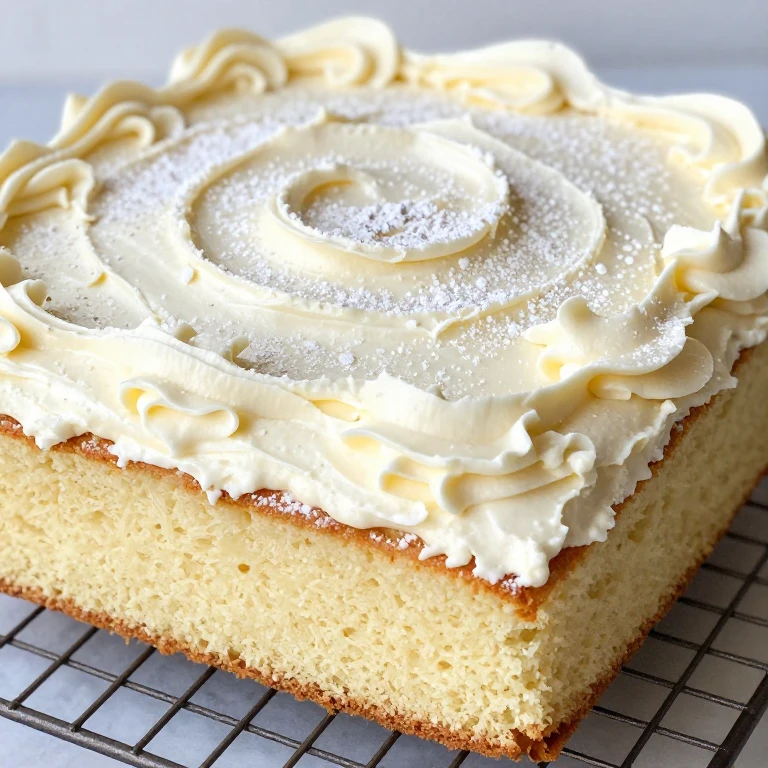 Golden sheet cake with thick fluffy vanilla buttercream frosting, overhead view