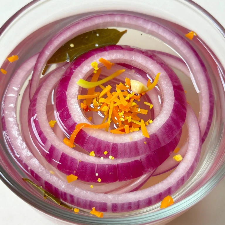 Citrus zest pickled red onions with bay leaves in brine
