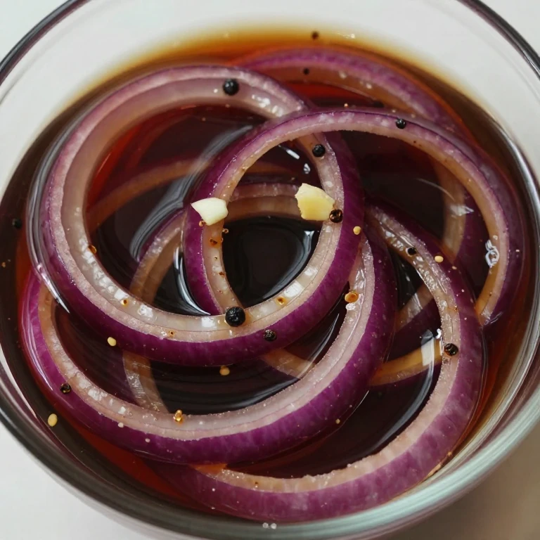 Balsamic-brown sugar pickled red onions with garlic and peppercorns