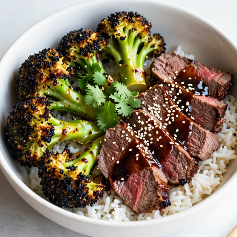 Lemongrass beef with charred broccoli, kecap manis glaze, and sesame seeds