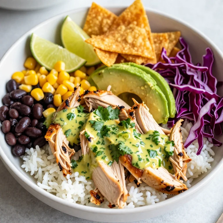 Cilantro-lime chicken bowl with avocado and crispy tortilla strips