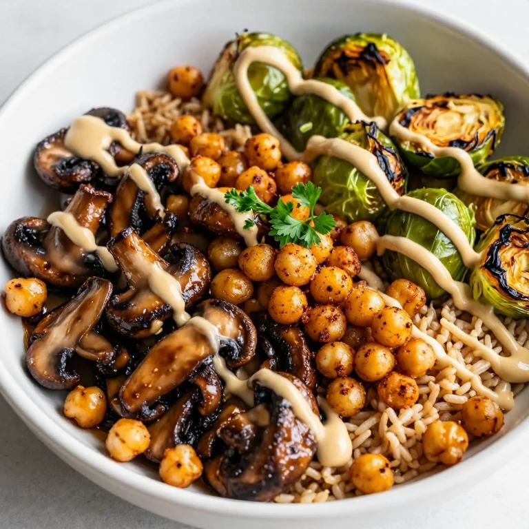 Garlicky mushroom and crispy chickpea bowl with brown rice, Brussels sprouts, and tahini