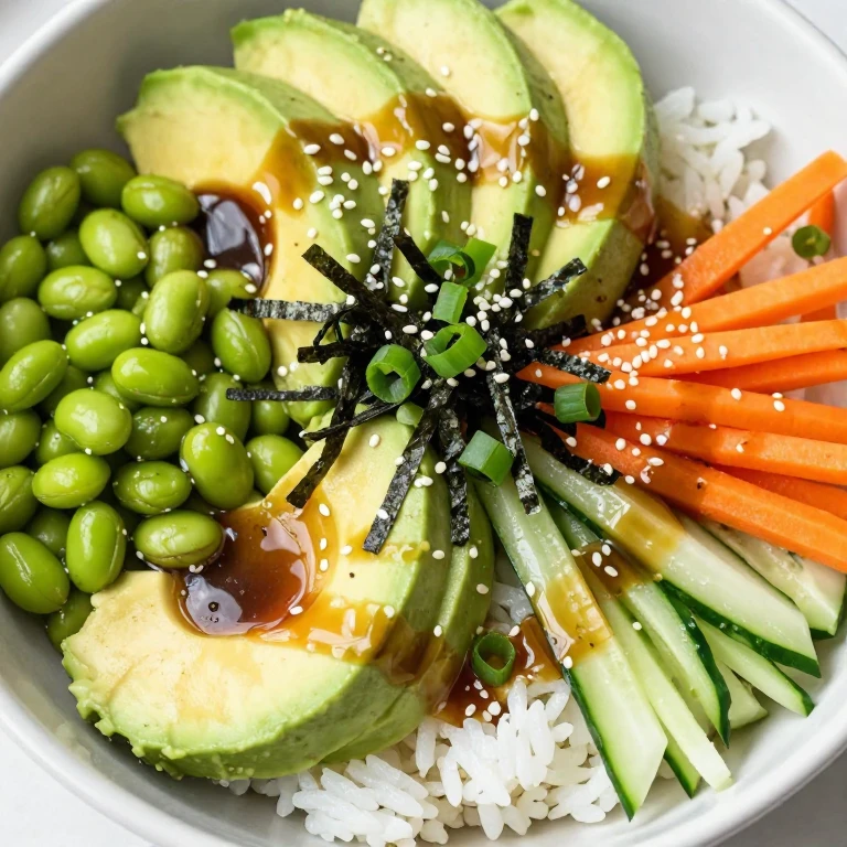 Edamame and avocado bowl with sushi rice, miso-ginger dressing, and nori strips
