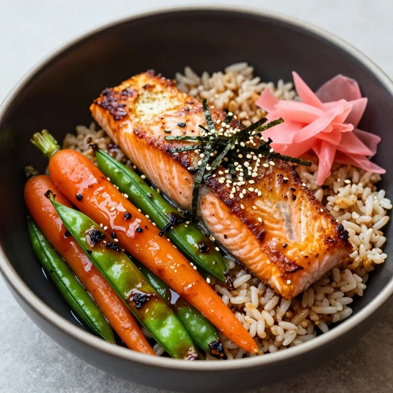 Teriyaki salmon bowl with crispy skin, charred vegetables, and ginger