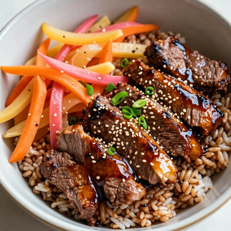 Beef bulgogi rice bowl with pickled vegetables and sesame seeds
