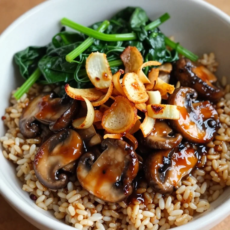 Mushroom and barley miso bowl with wilted spinach and crispy shallots over brown rice