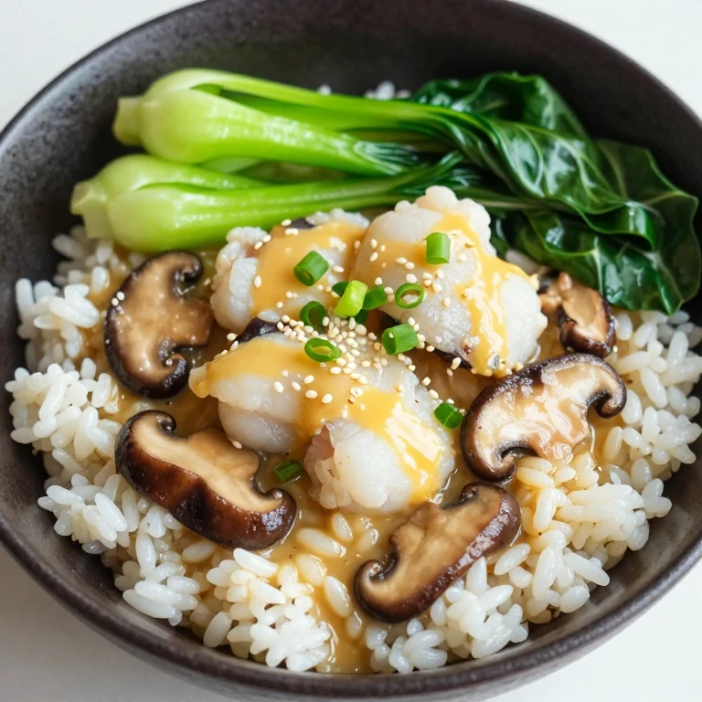 Miso-butter cod rice bowl with bok choy, mushrooms, and sesame seeds