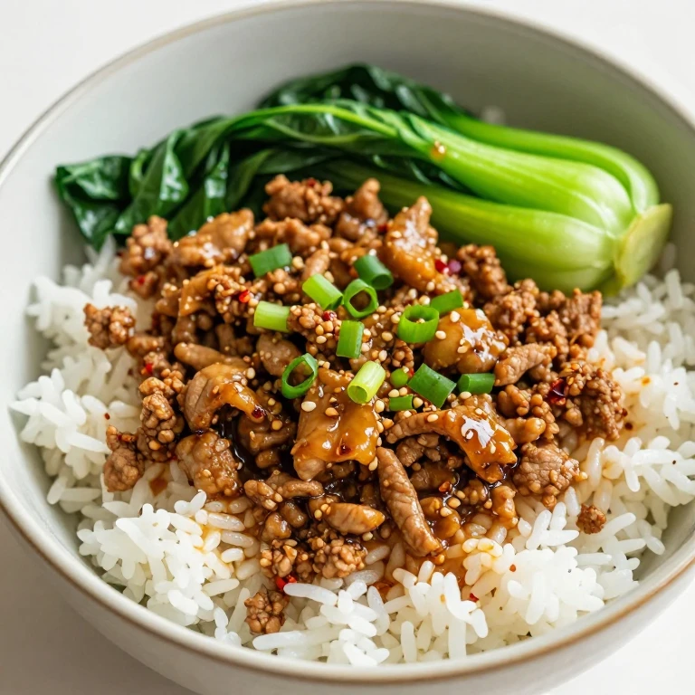 Ginger scallion pork and bok choy rice bowl with red pepper flakes
