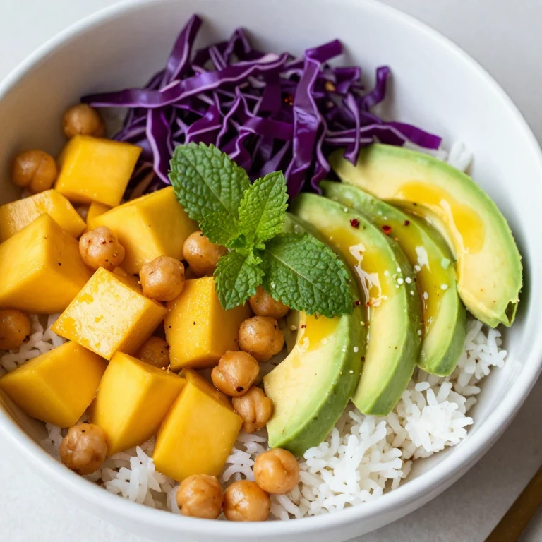 Mango avocado lime rice bowl with crispy chickpeas and fresh herbs