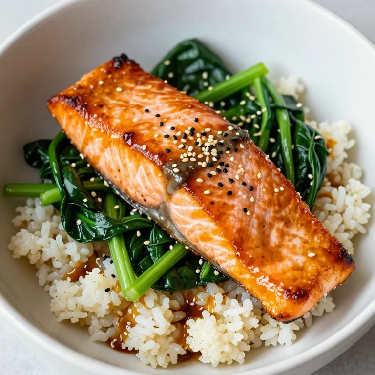 Miso-glazed salmon with greens, cauliflower rice, and sesame seeds