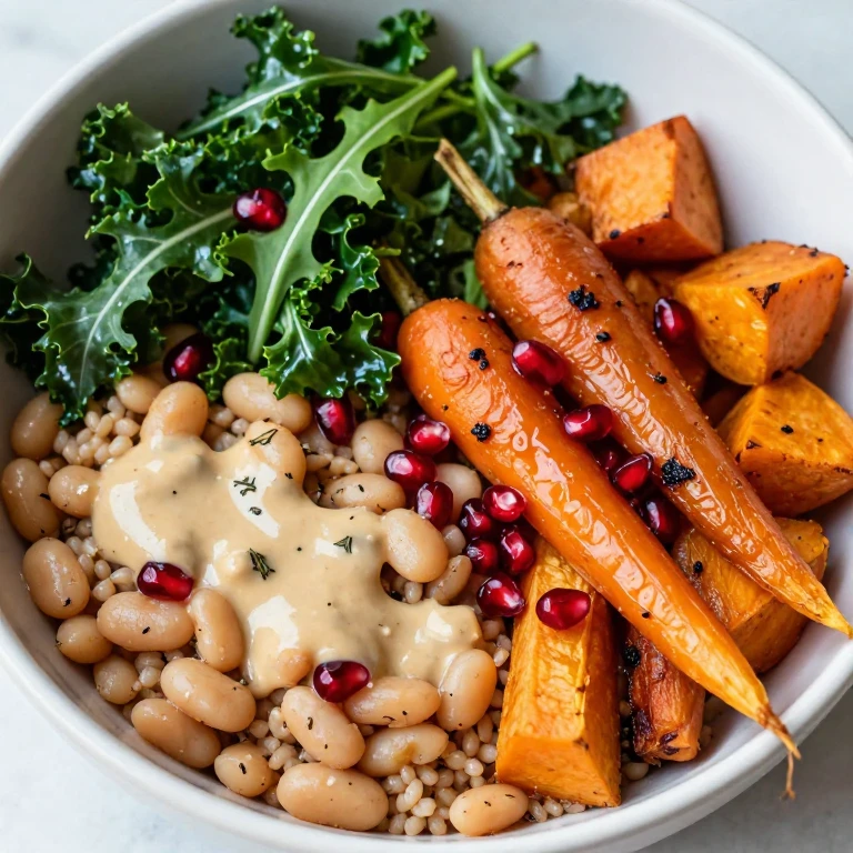 Roasted root vegetable and white bean bowl with tahini dressing and pomegranate