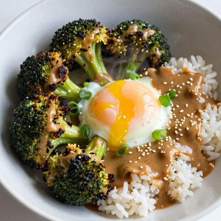 Charred broccoli and miso butter bowl with egg, sesame, and scallions