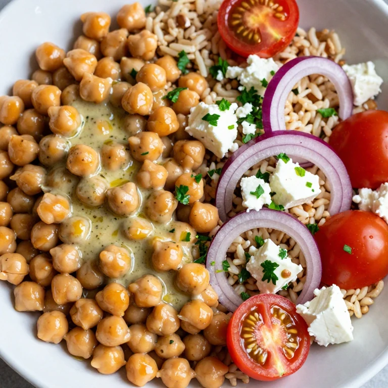 chickpea and herb salad with feta, brown rice, tomatoes, red onion, parsley
