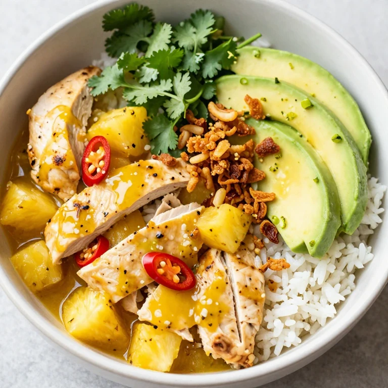 Chili-lime pineapple chicken with cilantro, crispy shallots, and avocado on jasmine rice
