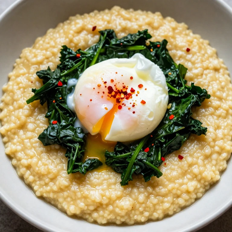Smoked gouda grits with wilted greens and poached egg topped with red pepper flakes