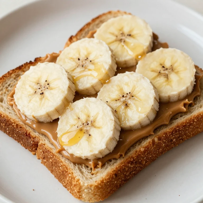 toasted bread sandwich with peanut butter, banana slices, and honey drizzle
